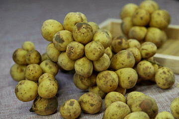 closeup bunch of ripe Longkong fruit on table