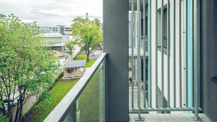 Balcony in luxury residential complex. Modern design. Metal partition.