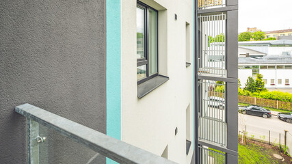 Balcony in luxury residential complex. Modern design. Metal partition.