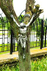 Souvenir figurine of Jesus on a tree. Catholic faith 