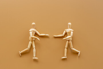 Man and woman connection. Couple of wooden mannequin figures.