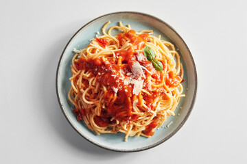 Spaghetti Bolognese with tomato topping and parmesan