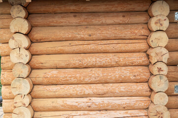 House wall in the village. Russian masonry of logs in the southern Urals.