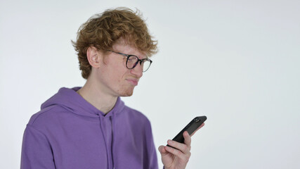 Failure on Smartphone by Redhead Young Man on White Background