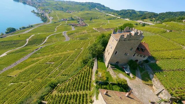 Marsens Tower In The Middle Of Vineyard Landscape At The Shore Of Lake Leman In Lavaux, Vaud, Switzerland. drone FPV