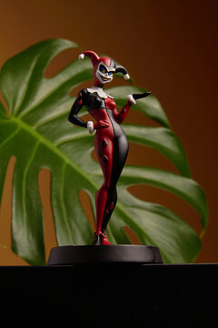 Udachny, Russia - August 27, 2021: The figure of Harley Quinn gracefully stands against a beige background.
This is a superhero from the movie that appears in DC comics.