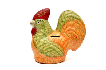 Colorful chicken piggy banks made of ceramic on a white background