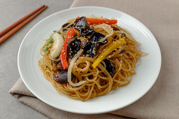 Korean food Japchae with vermicelli and vegetables