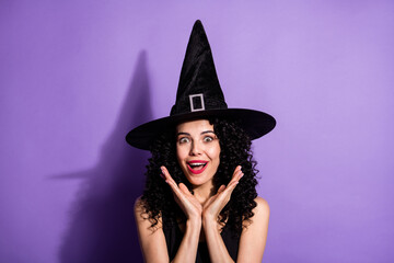 Portrait of young beautiful amazed smiling girl witch see big sale discount black friday isolated on violet color background