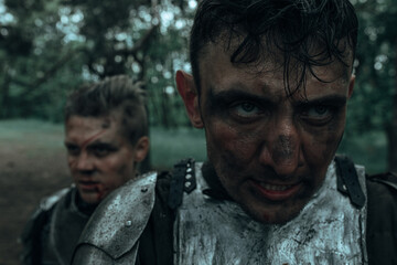 Obraz premium Portrait of two medieval knights with dirty faces.