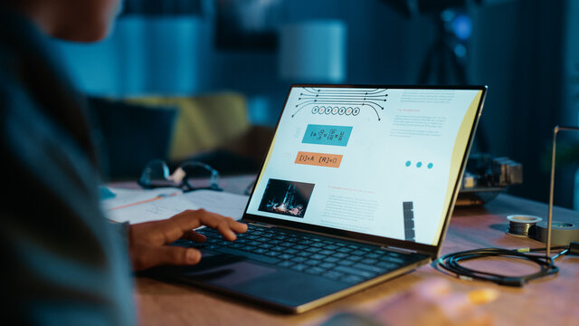 Young Teenage Multiethnic Schoolgirl is Studying Science Topic About Robotics at Home. Girl is Working on Homework for School. Young Female Reading Research Articles About Her Hobby. Education Concept