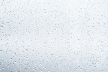 Rain drops and dew. water drops on a gray car roof after stopped raining , selective focus waterproof surface. soft focus. Leave space for writing text background.