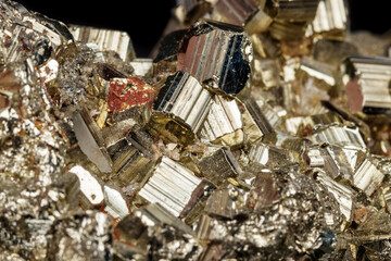 Macro mineral stone Pyrite on a black background