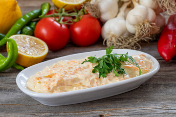Carrot salad is prepared with grated carrots, garlic and yogurt. Traditional turkish cuisine