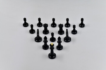 Achieving goals and objectives in business, chess pieces as a team