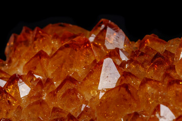 Macro mineral stone Citrine in rock in crystals on a black background