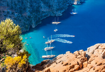 Butterfly Valley (Turkish: Kelebekler Vadisi) is a valley in Fethiye district, Mugla Province, on the Mediterranean coast of Turkey. Oludeniz - Fethiye, Mugla, Turkey.