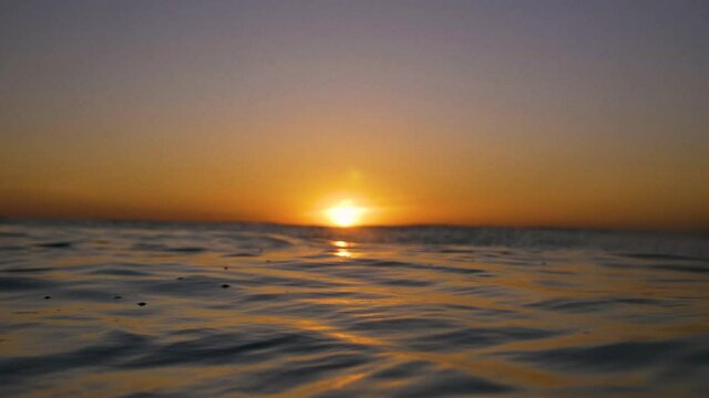 Ocean waves surface sunset 