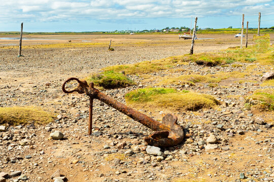 Ravenglass Cumbria at low water with an old anchor in the foreground