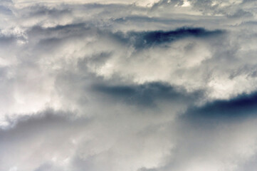 Fototapeta na wymiar White cumulus clouds on blue sky background, natural phenomenon