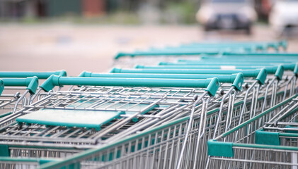 The shopping carts are neatly stacked together. to wait for customers to choose to shop in the supermarket