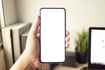 Hand holding or using smartphone with one hand. Smartphone with white blank on screen, Cellphone mockup.