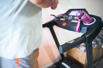 Motion of a Man running in a gym on a treadmill concept for exercising, fitness and healthy lifestyle