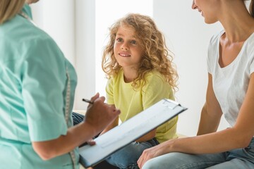 Helpful dietitian holding the chock, preparing healthy diet plan for her patients