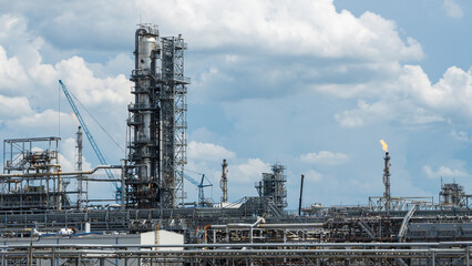 Fototapeta na wymiar Industrial view at oil refinery plant form industry zone with cloudy sky. Industry concept.