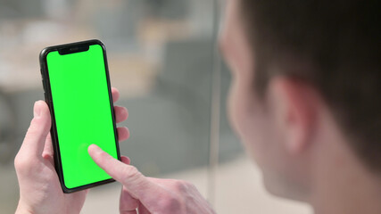 Man Clicking on Smartphone with Chroma Screen