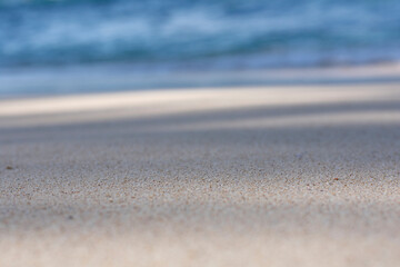 Fototapeta na wymiar beach sand nature background with selective focus. beach blur background