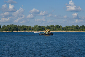 A tugboat on the river. River navigation