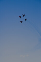 Flight of a group of jet planes. Performance of jet planes at an air show