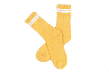 Pair of yellow socks isolated on white