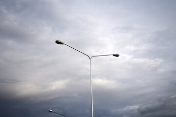 street lamp against blue sky