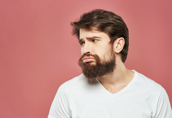 Fototapeta premium emotional man in a white t-shirt irritated facial expression Lifestyle