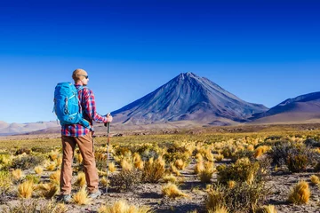 Printed roller blinds Canary Islands Hiker looking at view during a hiking trip with beautiful volcano landscape Atacama desrt. Chile