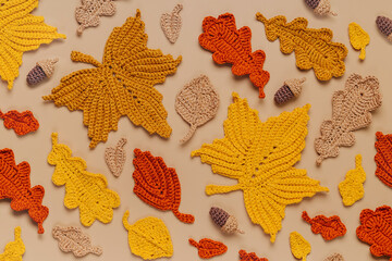 Pattern made of knitting yellow leaves. Autumn background. Fall mood