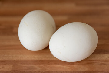 Two raw fresh whole white hens eggs for breakfast