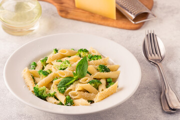 Pasta with green peas, broccoli and parmesan cheese.