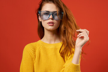 attractive woman holding hair glasses fashion yellow sweater