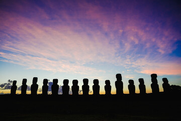 Fifteen standing moai on Ahu Tongariki against dramatic sunrise sky in Easter Island, Chile - obrazy, fototapety, plakaty