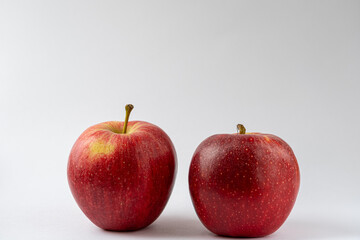 Two red apples against a white background. Royal gala apples. Food product photography