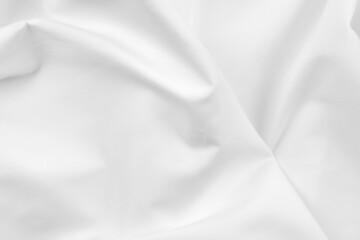 Abstract white fabric texture background. Cloth soft wave. Creases of satin, silk, and cotton.