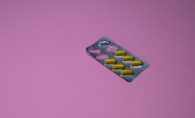 medicines in packaging on a plain background. Pharmacy theme, capsule tablets with medicinal antibiotic in packs. medicines for the elderly. space for text
