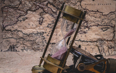 Sandglass On Old World Map