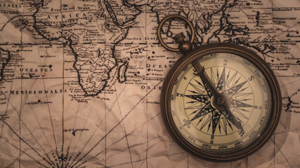 Fototapeta na wymiar Nautical Brass Compass On Map