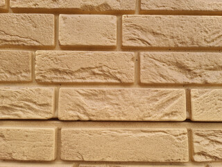 In the Imitation brick close-up. Building. Brick background. Plastic.