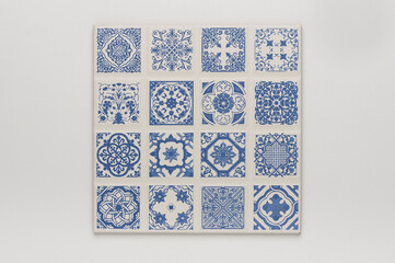 Square tile with arabesque blue grid pattern, isolated