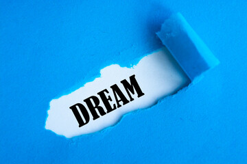 Dream text appearing behind blue color paper